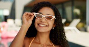 A young woman enjoying her spring break. Following spring break road safety tips can help you reach your destination without any issues.