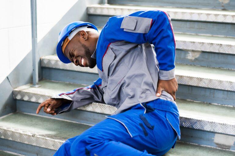A working man injured in a slip and fall accident on the stairs.